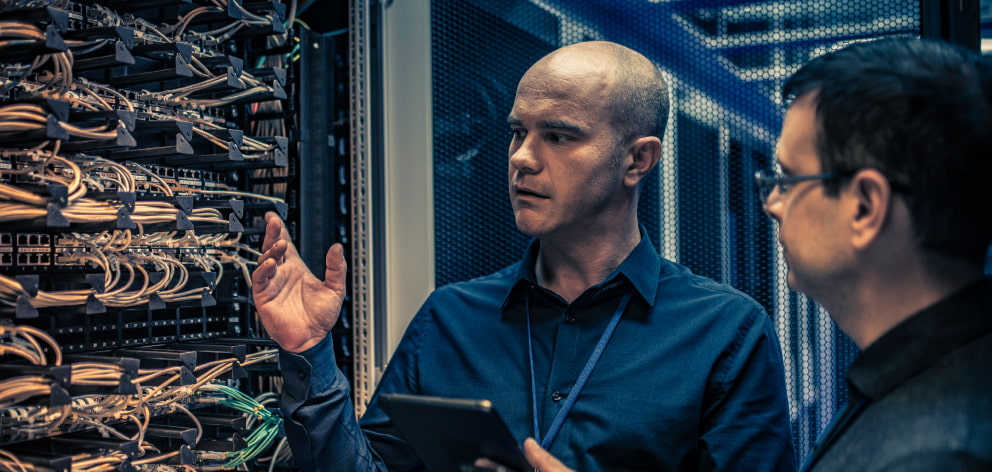 Data Center Engineer Checking Communication Rack