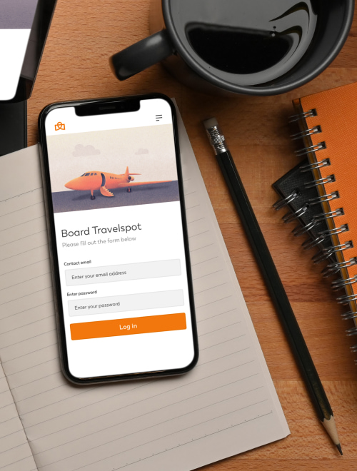 Travelspot mobile app on the desk mockup